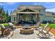 Backyard with a fire pit, outdoor seating, and a beautifully designed stone patio perfect for gatherings at 1005 Palace Ct # 58, Indian Trail, NC 28079