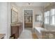 Bathroom with granite-topped vanity, tub, and access to a bedroom creates a luxurious and convenient space at 1005 Palace Ct # 58, Indian Trail, NC 28079