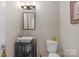 Modern bathroom featuring a vessel sink, dark vanity, and neutral wall color at 1005 Palace Ct # 58, Indian Trail, NC 28079