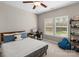 Bright bedroom with a full bed, desk, and large window at 1005 Palace Ct # 58, Indian Trail, NC 28079
