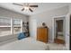 Bright bedroom features a ceiling fan, natural light from the window, and neutral wall color at 1005 Palace Ct # 58, Indian Trail, NC 28079