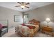Comfortable bedroom with floral bedding, wooden furniture, and natural light at 1005 Palace Ct # 58, Indian Trail, NC 28079