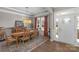 Formal dining room featuring hardwood floors, detailed trim, and large windows providing natural light and elegant charm at 1005 Palace Ct # 58, Indian Trail, NC 28079