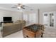 Bright, expansive game room with a foosball table and comfortable seating area at 1005 Palace Ct # 58, Indian Trail, NC 28079