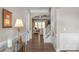 Inviting hallway with hardwood flooring and an arched entrance, leading to a bright living space with ample natural light at 1005 Palace Ct # 58, Indian Trail, NC 28079