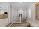 Bright hallway with staircase, hardwood floors, and decorative details at 1005 Palace Ct # 58, Indian Trail, NC 28079