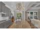 Gourmet kitchen island featuring granite countertops, a stainless steel sink, and bar stool seating at 1005 Palace Ct # 58, Indian Trail, NC 28079