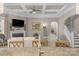 Living room with coffered ceiling, fireplace, and staircase access at 1005 Palace Ct # 58, Indian Trail, NC 28079