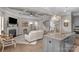 Open living area featuring a fireplace, a coffered ceiling, and a view of the modern kitchen at 1005 Palace Ct # 58, Indian Trail, NC 28079