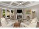 Cozy living room featuring a fireplace, coffered ceiling, and a large window with natural light at 1005 Palace Ct # 58, Indian Trail, NC 28079