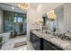 Modern bathroom with granite countertop, large mirrors, and blue tile shower at 101 S Shore Dr, Belmont, NC 28012