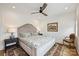 Elegant bedroom with a decorative rug, stylish lamps, and a comfortable queen-sized bed at 101 S Shore Dr, Belmont, NC 28012