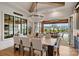 Inviting dining room with a large table and view of the outdoor living space and pool at 101 S Shore Dr, Belmont, NC 28012