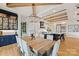 Elegant dining room with a large table, decorative chandelier, and access to outdoor area at 101 S Shore Dr, Belmont, NC 28012