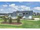 A lakefront home featuring a modern farmhouse design and well-maintained landscaping at 101 S Shore Dr, Belmont, NC 28012
