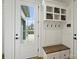 Functional mudroom with a storage bench, hooks, and a view of the exterior at 101 S Shore Dr, Belmont, NC 28012