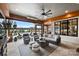 Spacious covered patio with comfortable seating area and view of the pool at 101 S Shore Dr, Belmont, NC 28012