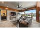 Covered patio with comfortable seating area and access to the backyard and pool at 101 S Shore Dr, Belmont, NC 28012