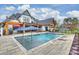 Beautiful pool with fountains, umbrellas and lounge area, perfect for relaxing and enjoying the outdoors at 101 S Shore Dr, Belmont, NC 28012