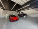 Spacious garage featuring a boat, helicopter, sports cars, epoxy flooring, and recessed lighting at 108 Winners Cir # 5, Mooresville, NC 28117