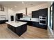 Beautiful, spacious kitchen with dark cabinets, white countertops, and stainless steel appliances at 108 Winners Cir # 5, Mooresville, NC 28117