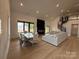 Open living space featuring high ceilings, spiral staircase, modern fireplace, and large windows at 108 Winners Cir # 5, Mooresville, NC 28117