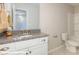 Bathroom with a single sink vanity with white cabinets and shower over tub at 116 Asmodean Ln, Troutman, NC 28166