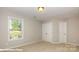 Bedroom with plush carpet, neutral walls, and natural light from the window at 116 Asmodean Ln, Troutman, NC 28166