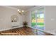 Dining area features a designer light fixture, built in cabinets, and sliding glass doors to patio at 116 Asmodean Ln, Troutman, NC 28166