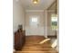 Welcoming entryway with classic wainscoting and a stylish wood accent chest at 116 Asmodean Ln, Troutman, NC 28166
