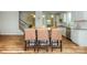 Kitchen island with seating, granite countertops, and modern stainless steel appliances at 116 Asmodean Ln, Troutman, NC 28166