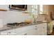 Modern kitchen featuring granite countertops, stainless steel appliances, and a subway tile backsplash at 116 Asmodean Ln, Troutman, NC 28166
