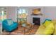 Bright living room features a cozy fireplace and large windows for natural light at 116 Asmodean Ln, Troutman, NC 28166