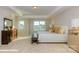 Bright bedroom with a tray ceiling, plush carpeting, and abundant natural light at 116 Asmodean Ln, Troutman, NC 28166