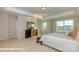 Large bedroom featuring a tray ceiling, neutral color palette, and generous natural light at 116 Asmodean Ln, Troutman, NC 28166