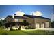 Rendering of exterior elevation with porch, garage doors, stone chimney, and stylish dark siding and black metal roof at 118 Winners Cir # 4, Mooresville, NC 28117