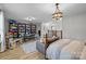 Spacious bonus room with a comfortable sofa, play area, and abundant built-in shelving at 1205 Brooksland Pl, Waxhaw, NC 28173