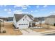 Beautiful exterior view of home with manicured front yard and white picket fence at 1205 Brooksland Pl, Waxhaw, NC 28173