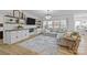 Bright living room featuring built-in shelves, modern lighting, and a comfortable sectional sofa at 1205 Brooksland Pl, Waxhaw, NC 28173