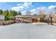 Expansive backyard featuring an oversized garage, lounge seating, and a basketball court at 126 Goat Trl, China Grove, NC 28023