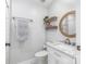 Stylish bathroom with a marble countertop, framed mirror, and white cabinetry at 126 Goat Trl, China Grove, NC 28023