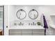 Bathroom featuring a double vanity, dual round mirrors, and elegant fixtures for a modern and functional space at 126 Goat Trl, China Grove, NC 28023