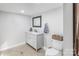 Bathroom featuring a vanity with a marble countertop, a toilet, and a modern mirror at 126 Goat Trl, China Grove, NC 28023