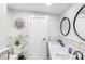 Bright bathroom with a modern sink, stylish mirror, toilet, and decorative floral accents at 126 Goat Trl, China Grove, NC 28023