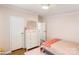 Cozy bedroom featuring a wooden floor, white trim, a closet, and natural light at 126 Goat Trl, China Grove, NC 28023
