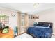 Well-lit bedroom with a window, desk, and plush carpeting for a comfortable retreat at 126 Goat Trl, China Grove, NC 28023