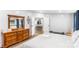 Bright bedroom featuring an open doorway to the kitchen and a beautiful wood dresser with a mirror at 126 Goat Trl, China Grove, NC 28023