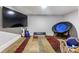 Relaxing bonus room with television, chair, and carpet at 126 Goat Trl, China Grove, NC 28023
