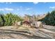 Inviting single-story home featuring a charming covered porch, lovely landscaping, and a serene, tree-lined setting at 126 Goat Trl, China Grove, NC 28023