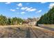 Charming single-story home with a welcoming covered porch and mature landscaping, nestled among lush trees on a spacious lot at 126 Goat Trl, China Grove, NC 28023